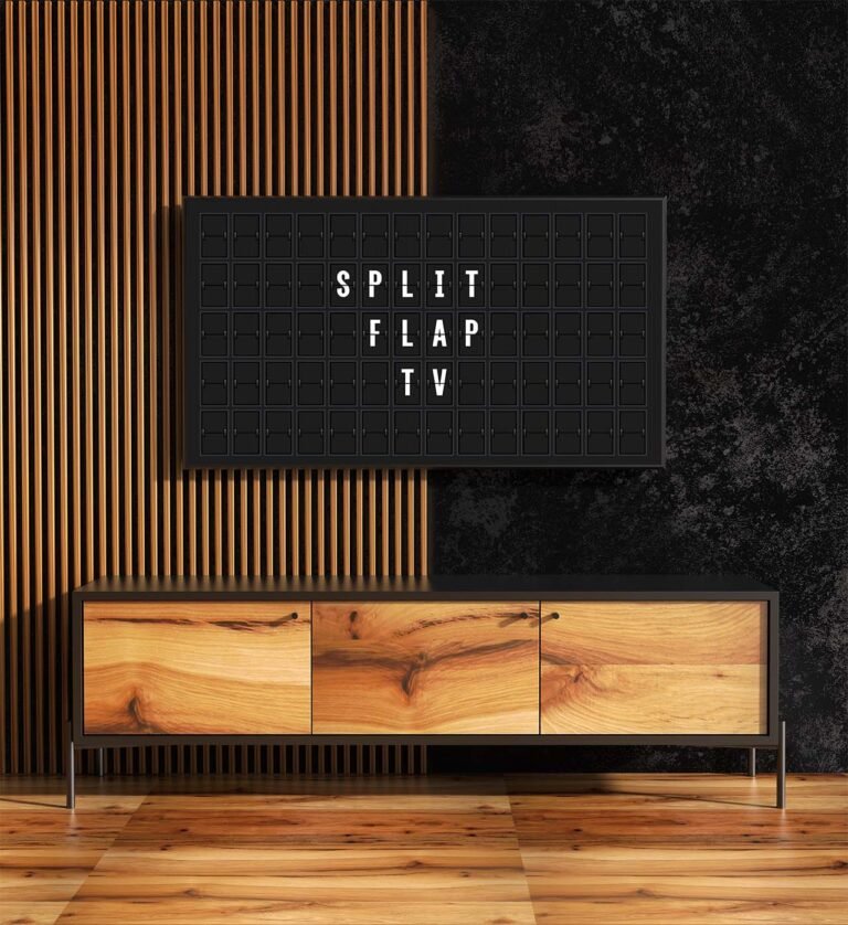 a split flap television hanging on the wall showing split flap messages