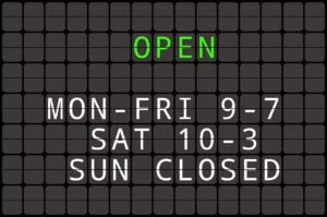 Split Flap TV with opening hours of a shop