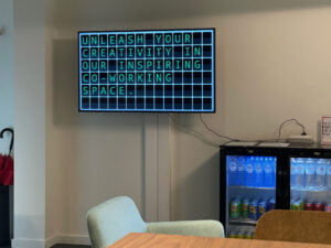 Co working space Regus is using a Split Flap television at a central pointing showing messages in a nostalgic way