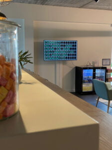 Co working space Regus is using a Split Flap television at a central pointing showing messages in a nostalgic way